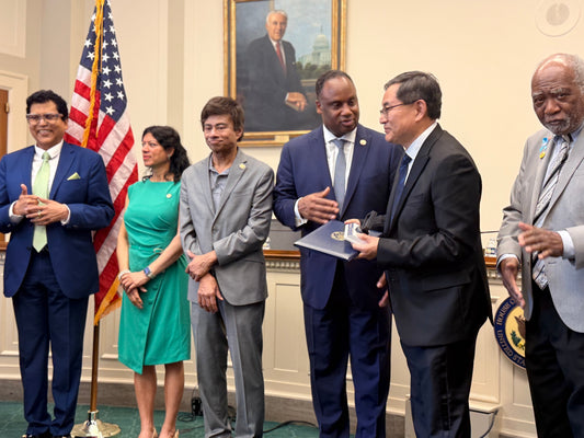 DrJiang receiving the Congressional Medal and Record
